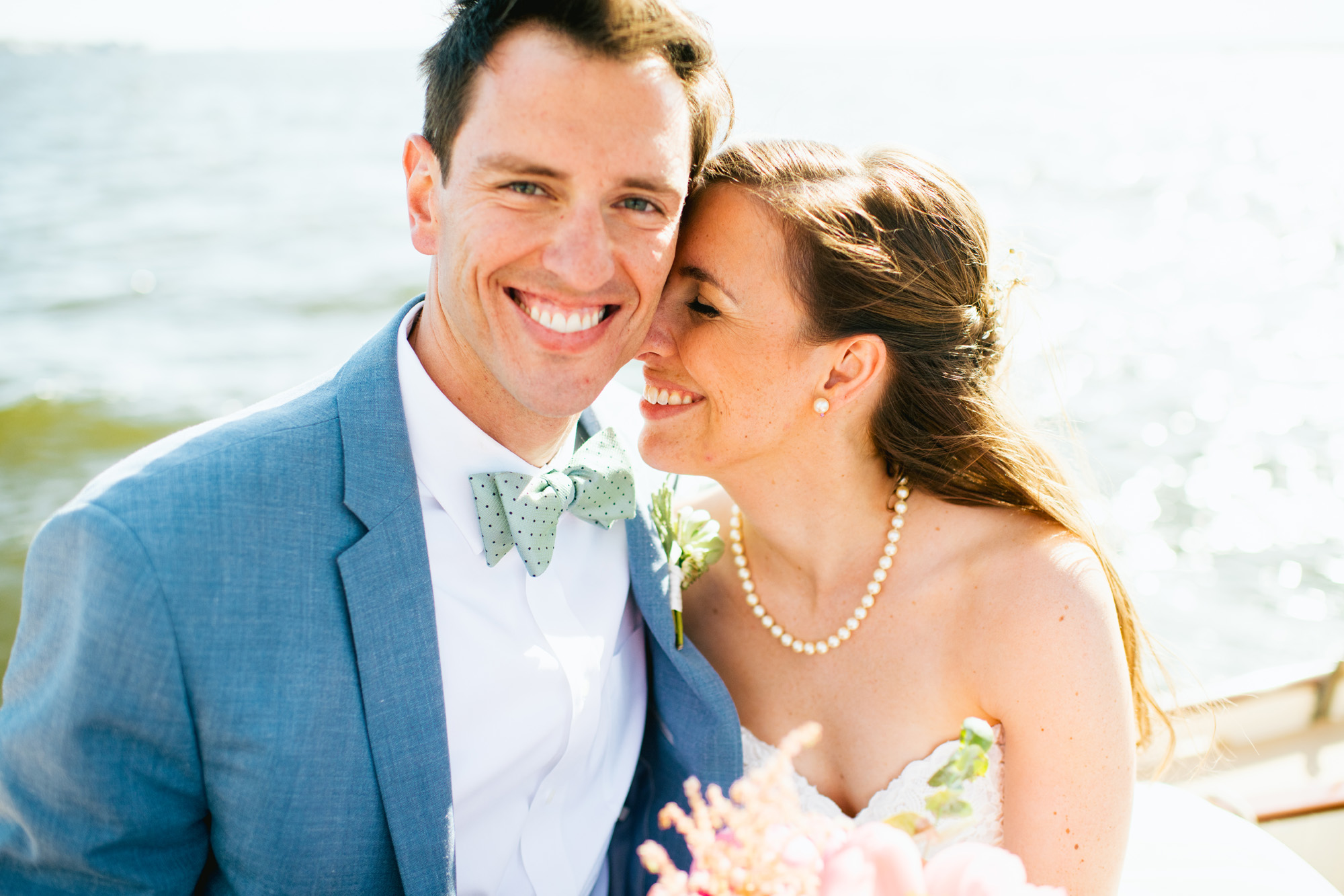 Backyard Mantaloking Shore Wedding Bride and Groom on a boat